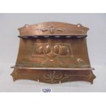 An Arts & Crafts/Art Nouveau copper pipe rack, 34 x 24 cm.