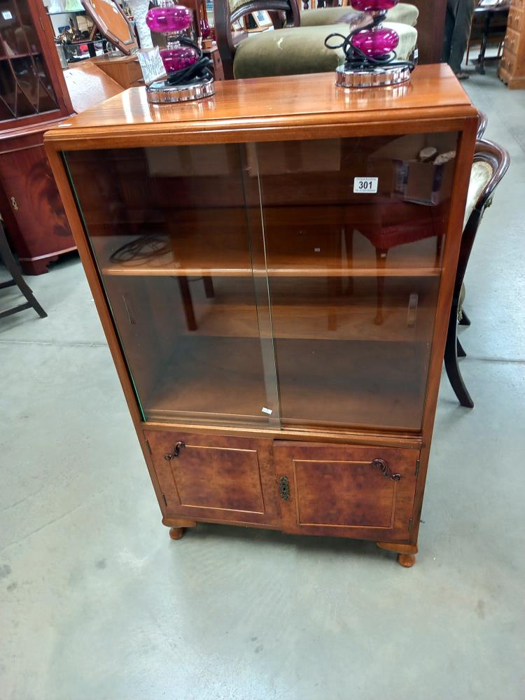 A vintage cabinet with 2 glass doors, approximately 71cm wide x 110cm high COLLECT ONLY.