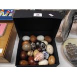 A box of eggs made from stone, marble, wood etc