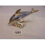 A Royal Crown Derby dolphin paperweight with stopper.
