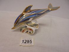 A Royal Crown Derby dolphin paperweight with stopper.