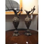 A pair of ornate resin ormalu style ewers height 43cm