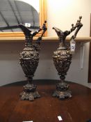 A pair of ornate resin ormalu style ewers height 43cm