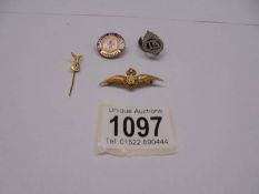 A 9ct gold RAF wings brooch, A TA badge No. 258582, a stick pin and a Red Cross badge.