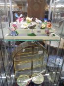 Twelve colourful porcelain butterflies with glass cabinet, COLLECT ONLY.