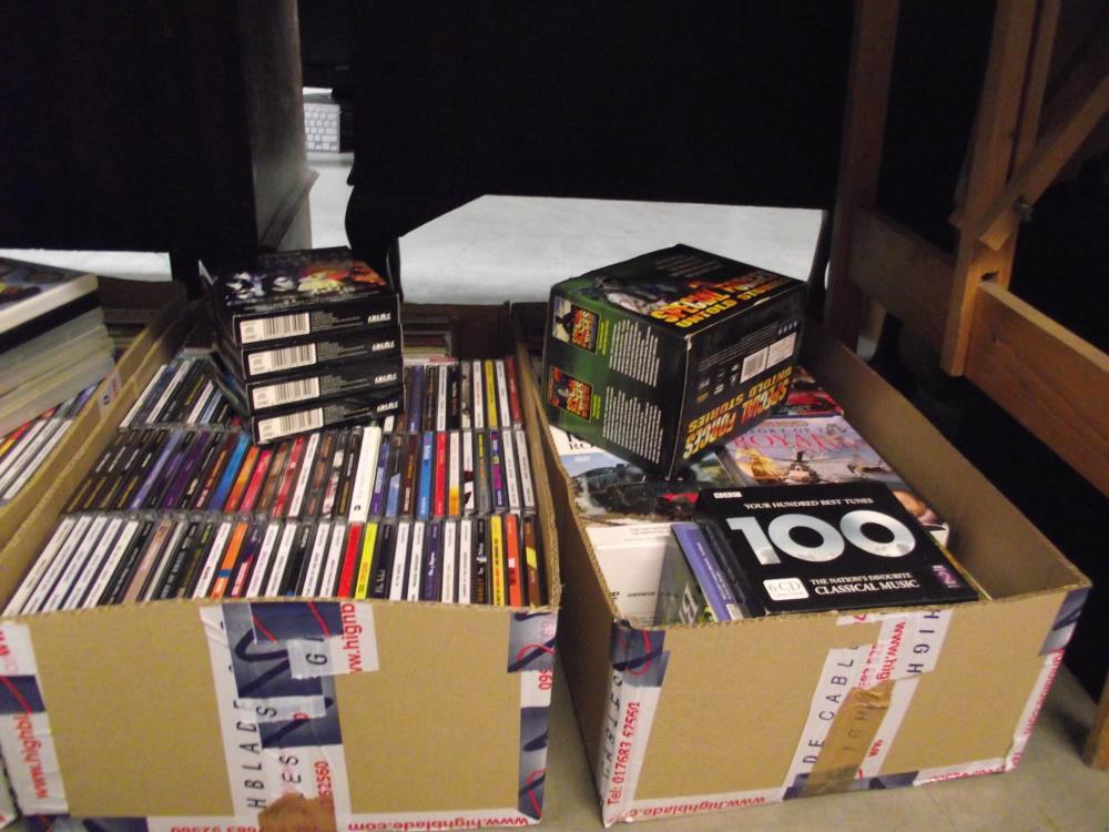 A large lot of CD's plus some DVD's + cassette tapes, DVD Boxes + headphones
