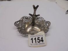 A silver ring tree with trinket dish base, circa 1900.