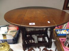 A dark oak drop leaf coffee table height 46cm, top 55cm x 68cm COLLECT ONLY