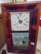 An early 20th century American wall clock. COLLECT ONLY.