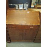 A 1930/50's oak bureau with cross banding inlay COLLECT ONLY