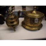 A Chinese brass insence burner and a hammered brass tobacco tin