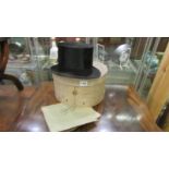 A Dunn & Co., top hat in original box, no size markings but possibly small.