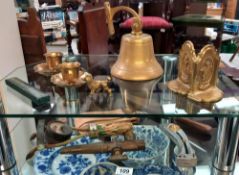 Selection of brassware including ships bell, bookends etc.