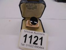 A 14k gold signet ring, 9 grams.