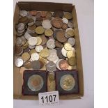 A mixed lot of UK and foreign coins.