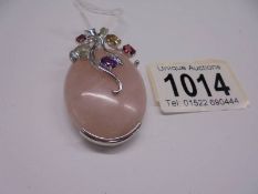 A silver and rose quartz pendant set coloured stones pendant.