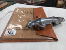 A Jaguar MK2 service handbook & a car mascot