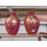 A pair of Carlsbad hand decorated vases, 32 cm tall.