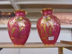 A pair of Carlsbad hand decorated vases, 32 cm tall.