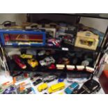 A quantity of die cast cars etc including boxed items
