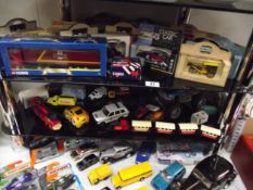 A quantity of die cast cars etc including boxed items