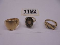 Three gold rings, total weight with stones, 18 grams.