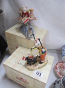 Two boxed Royal Doulton Rupert figures "Banging his Drum" and "Rupert Rides Home"