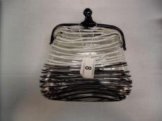 A decorative glass 'handbag'
