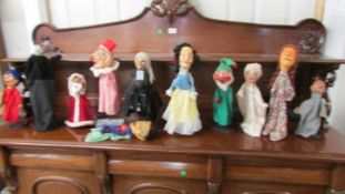 A quantity of early Punch and Judy hand puppets.