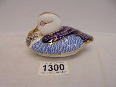 A Royal Crown Derby duck paperweight with stopper.