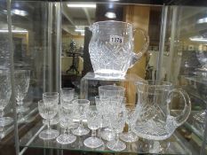 Two cut glass jugs and a quantity of glasses. COLLECT ONLY.