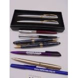 A quantity of ball point pens including advertising.