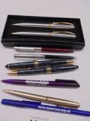 A quantity of ball point pens including advertising.