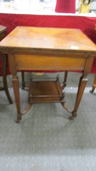 A Victorian 'envelope' fold out games table on castors, COLLECT ONLY.