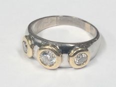An 18ct yellow & white gold ring set round brilliant cut diamonds, estimated diamond weight 0.83 ct