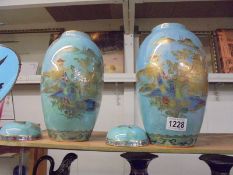A pair of Carlton ware Chinioiserie style lidded vases (one lid af).
