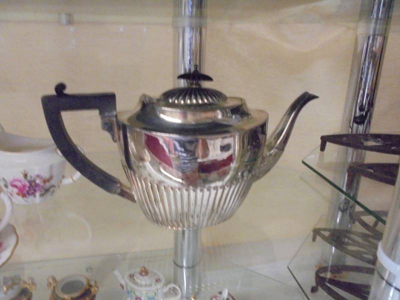 A three piece silver plate tea set. - Image 2 of 2