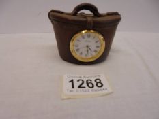 A novelty Aynsley clock in the shape of a Victorian hat box.