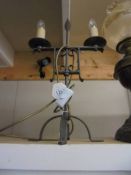 A wrought iron table lamp.