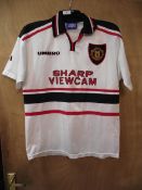 A 1999 Manchester United away shirt, size M