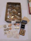 A mixed lot of UK and foreign coins.