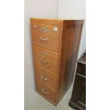 An oak four drawer filing cabinet. COLLECT ONLY.