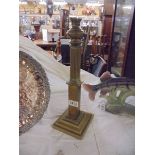 A brass oil lamp base.