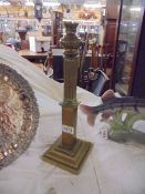A brass oil lamp base.