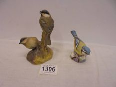 A Royal Worcester blue tit and Royal Worcester coal tits.