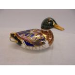 A Royal Crown Derby duck paperweight with stopper.