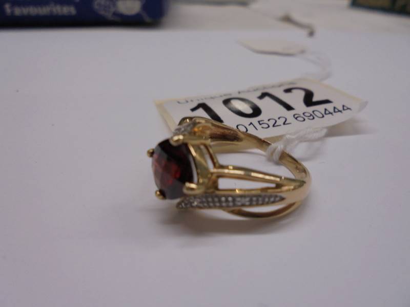 A 9ct gold ruby and diamond ring, size M, 2.9 grams. - Image 2 of 2