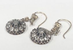 A pair of diamond earrings, (one stone needs refixing) total weight 5.95 grams.