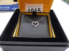A boxed Goldsmiths white gold and diamond heart pendant, 1.85 grams.