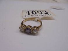 A 9ct yellow gold amethyst and CZ ring, size N, 2.4 grams.